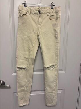 Free people Women’s light yellow Distressed Skinny Jeans